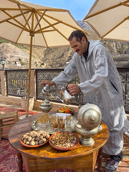 Omar pouring mint tea for guests