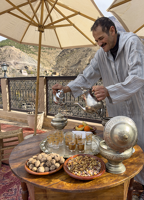 Omar welcomes guests with mint tea